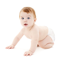 Image showing crawling curious baby