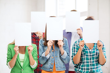 Image showing students covering faces with blank papers