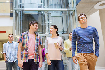 Image showing group of smiling students with paper coffee cups