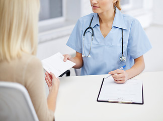 Image showing close up of doctor and woman meeting at hospital