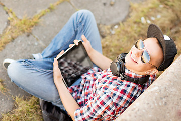 Image showing girl with headphones and tablet pc