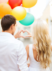 Image showing couple with colorful balloons