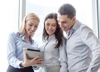 Image showing business team working with tablet pc in office