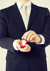 Image showing man with gift box and wedding ring
