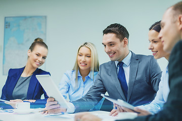 Image showing business team with tablet pc having discussion