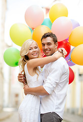 Image showing couple with colorful balloons