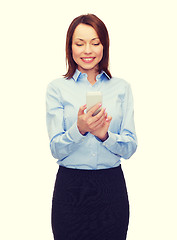 Image showing young smiling businesswoman with smartphone