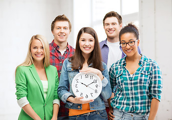 Image showing group of students at school with clock