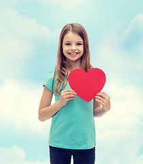 Image showing smiling little girl with red heart