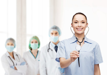 Image showing smiling female doctor or nurse with stethoscope