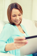 Image showing happy woman with tablet pc computer at home