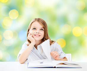 Image showing happy student girl with book at school