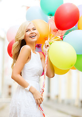 Image showing woman with colorful balloons