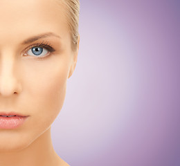 Image showing close up of beautiful young woman half face