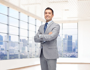 Image showing happy smiling businessman in suit