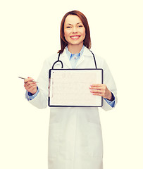 Image showing doctor with stethoscope, clipboard and cardiogram