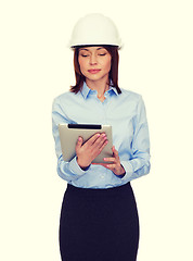 Image showing young calm businesswoman in white helmet