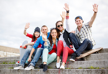 Image showing group of smiling teenagers hanging out