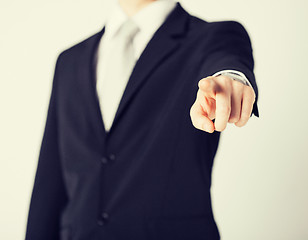 Image showing man pointing his finger at you