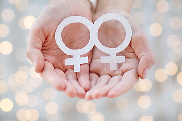 Image showing close up of happy lesbian couple with venus symbol