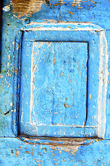 Image showing nail stripped paint  wood door and rusty 