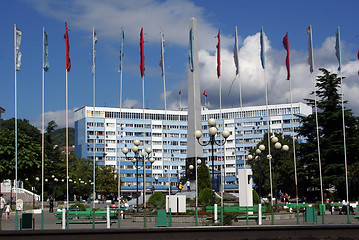 Image showing Long building and flags