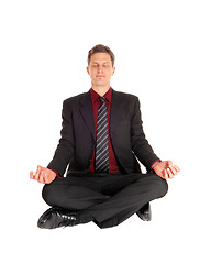 Image showing Businessman doing yoga.