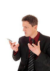 Image showing Man screaming in cell phone.