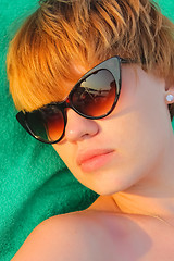 Image showing woman relaxing on the beach.