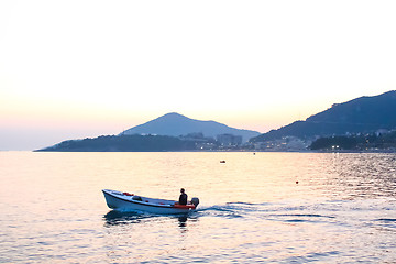 Image showing Scenic view at sea with fishman in boat