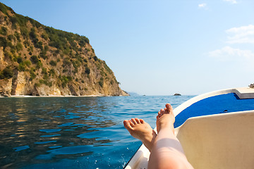 Image showing woman lounging on a catamaran sailboat