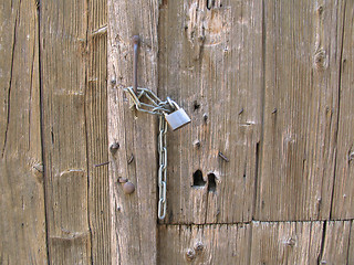 Image showing Old door with padlock