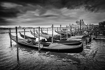 Image showing Gondolas with view of Santa Maria della Salute at sunset bw