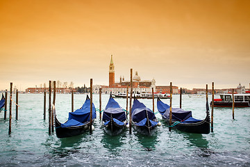 Image showing San Giorgio Maggiore with view of moored gondolas 