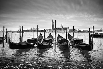 Image showing San Giorgio Maggiore church with moored gondolas bw