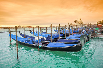 Image showing Gondolas with view of Santa Maria della Salute at sunset