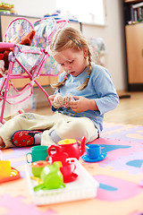 Image showing Cute girl playing with toys