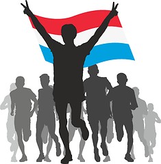 Image showing Winner with the Luxembourg flag at the finish