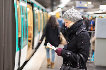 Image showing Lady waiting on subway station platform.