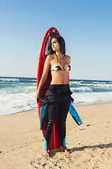 Image showing Surfer girl with her surfboard