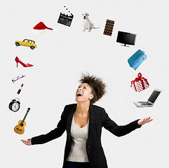 Image showing Afro-American woman juggling objects