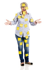 Image showing Elderly woman with yellow notes