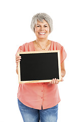 Image showing Old woman holding a chalkboard