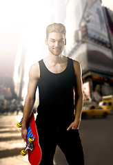 Image showing Young man with a skateboard