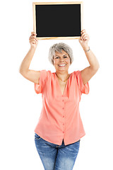 Image showing Old woman holding a chalkboard