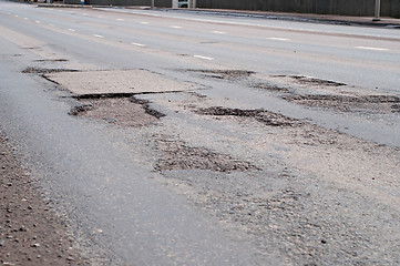 Image showing Big hole in street asphalt