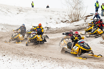 Image showing Snowmobiles moves on bend of sport track