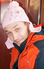 Image showing Young man in a childs hat