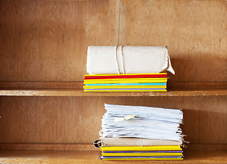 Image showing File folders, sheets of paper on the shelve