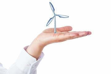 Image showing Wind Turbine Rising In The Palm Of A Hand